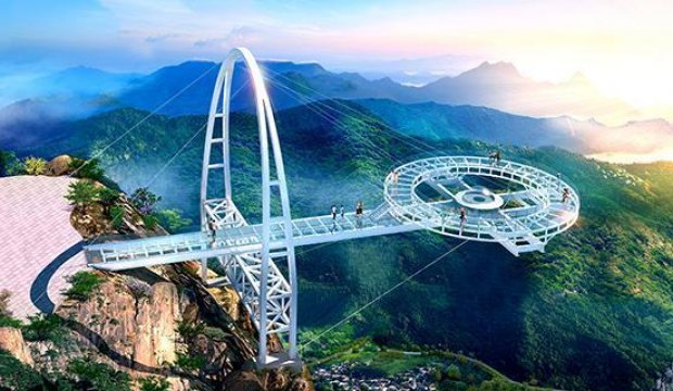 The first glass bridge with a waterfall with a full mountain view in northern Guangdong was completed